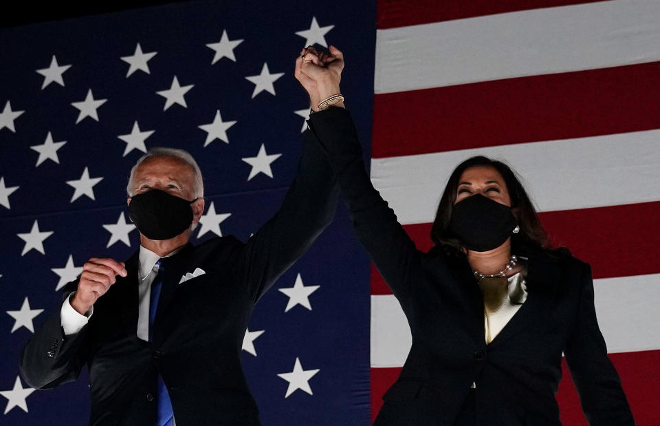 Former vice-president and Democratic presidential nominee Joe Biden (L) and Senator from California and Democratic vice presidential nominee Kamala Harris greet supporters outside the Chase Center in Wilmington, Delaware, at the conclusion of the Democratic National Convention, held virtually amid the novel coronavirus pandemic, on August 20, 2020. (Photo by Olivier DOULIERY / AFP) (Photo by OLIVIER DOULIERY/AFP via Getty Images)