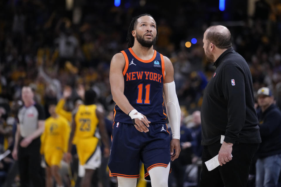 New York Knicks guard Jalen Brunson (11) walks to the bench during a timeout in the second half of Game 4 against the Indiana Pacers in an NBA basketball second-round playoff series, Sunday, May 12, 2024, in Indianapolis. (AP Photo/Michael Conroy)