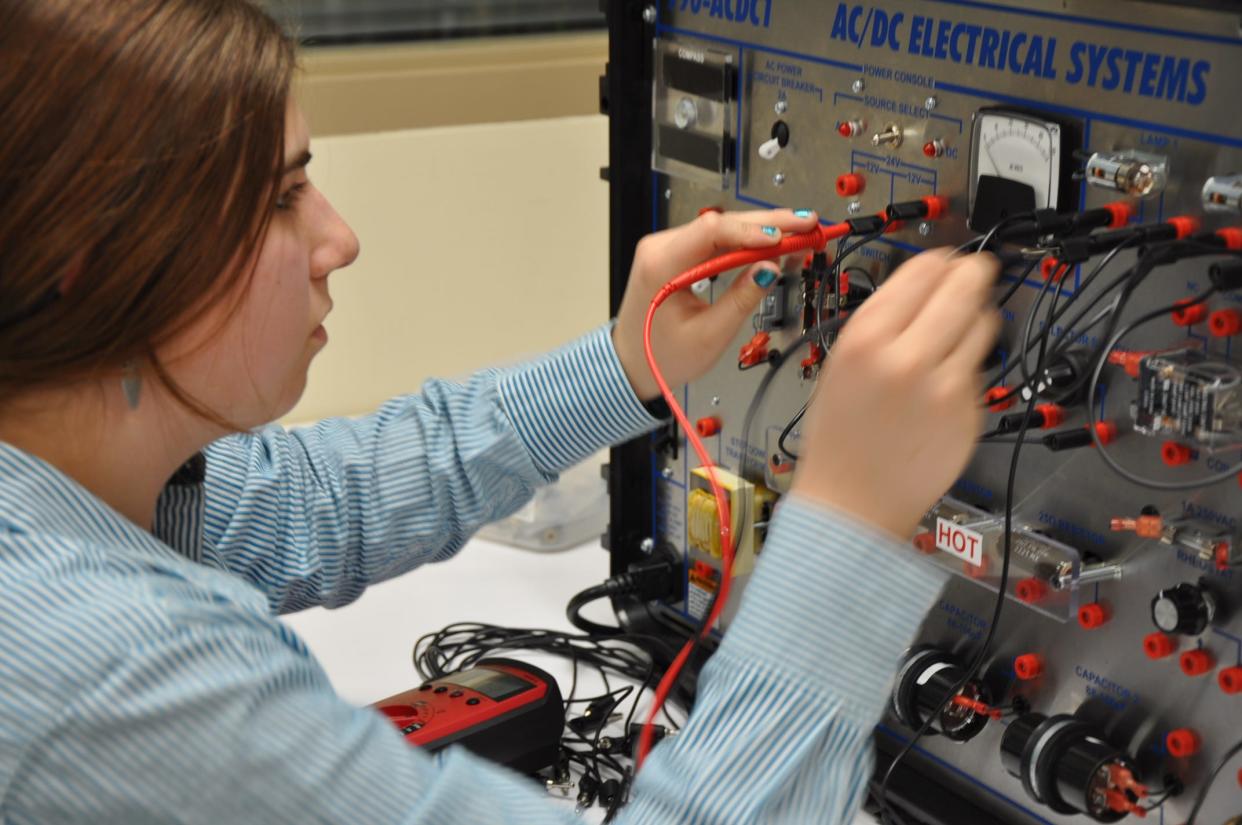 Jennifer Mondak, 18, a senior at West Branch High School, uses an AC/DC Electrical System on Thursday, Jan. 11, 2024, to create different voltages. She is one of 21 students in the school's first Industrial Maintenance program.