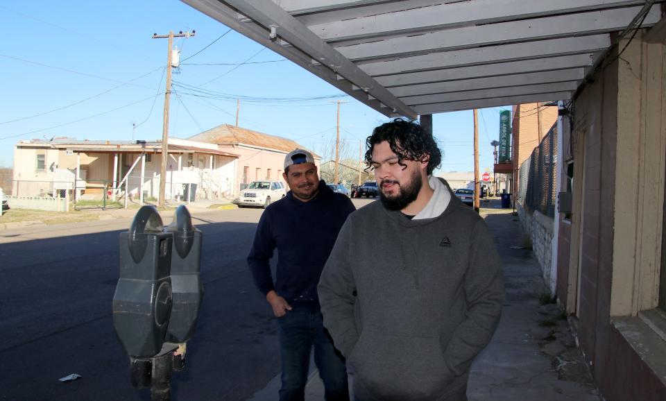 Brothers Hervey, left, and Martin Espinoza, right, who live in Piedras Negra, Mexico, do some shopping and eat lunch on Sunday, Feb. 4, 2024, in Eagle Pass, Texas. | Brigham Tomco, Deseret News