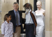 FILE - Australian Indigenous actor David Gulpilil, second right, film director Baz Luhrmann, second left, walks with actors Brandon Walters left, and Nicole Kidman right, following a press conference for their latest movie, Australia, in Sydney, Tuesday, Nov. 18, 2008. Gulpilil has died of lung cancer, a government leader said on Monday, Nov. 29, 2021. He was 68 years old. (AP Photo/Mark Baker, File)