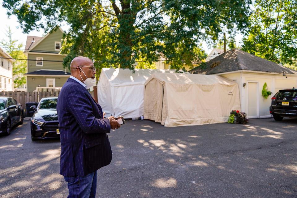 "I knew I needed to help these families," said John B. Houston outside Cushnie-Houston Funeral home in East Orange, N.J., one of three funeral homes he directs. "This is my calling. What I'm supposed to do. It's not easy."