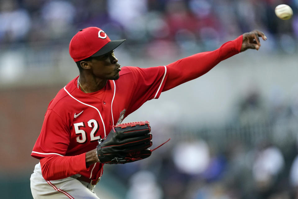 Cincinnati Reds starting pitcher Reiver Sanmartin (52) works against the Atlanta Braves in the first inning of a baseball game Friday, April 8, 2022, in Atlanta. (AP Photo/John Bazemore)