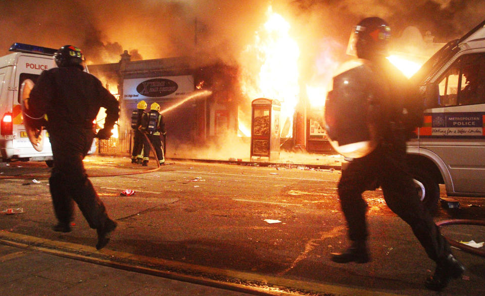 PREVIOUSLY UNSEEN PICTURES OF THE RIOT IN TOTTENHAM TAKEN SATURDAY AUGUST 6.  Riot police patrol the streets in Tottenham, north London as trouble flared after members of the community took to the streets to demand "justice", after Mark Duggan, 29, was shot dead by police on Thursday. 