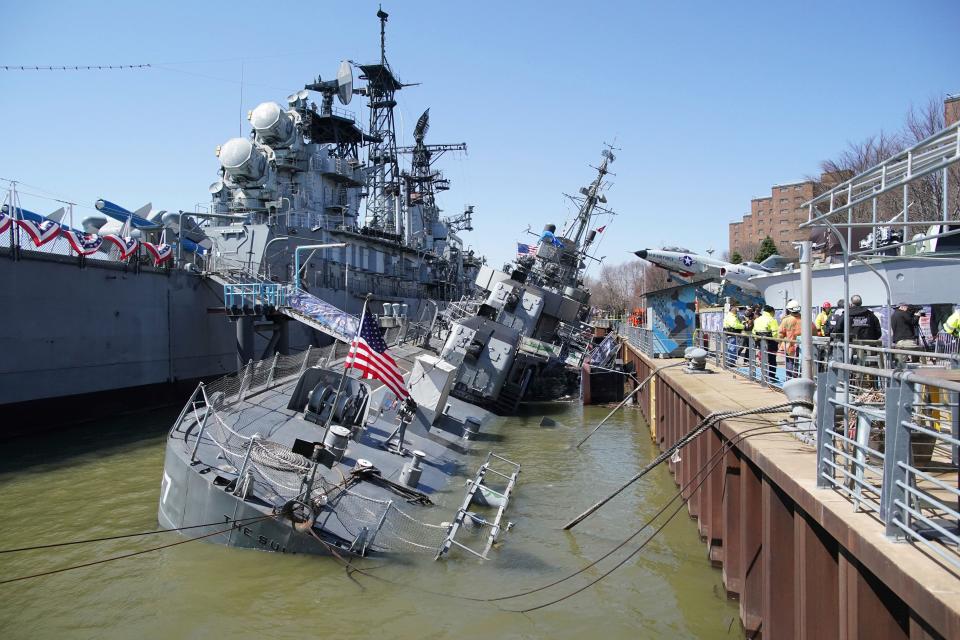 The vintage battleship USS The Sullivans is listing to one side after taking on water at the Buffalo and Erie County Naval & Military Park in Buffalo, New York, on Thursday, April 14, 2022.