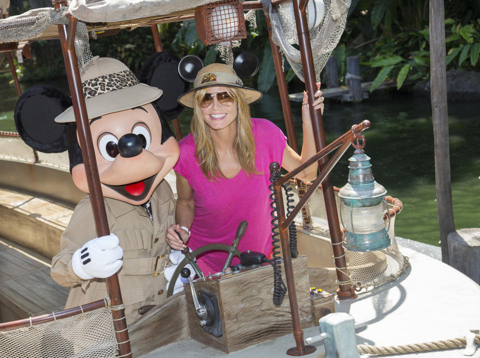 ANAHEIM, CA - MAY 28:  In this handout photo provided by Disney Parks, Heidi Klum joins Mickey Mouse aboard the world-famous Jungle Cruise attraction May 28, 2014 at Disneyland in Anaheim, California.  (Photo by Paul Hiffmeyer/Disney Parks via Getty Images)