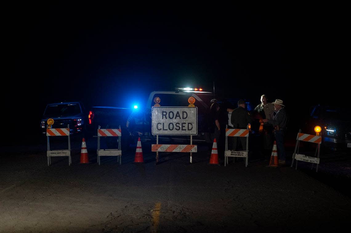Authorities close a section of Indiana Road as they investigate after the bodies of four kidnapped victims in a rural area north of Dos Palos in Merced County, Calif., on Wednesday, Oct. 5, 2022.