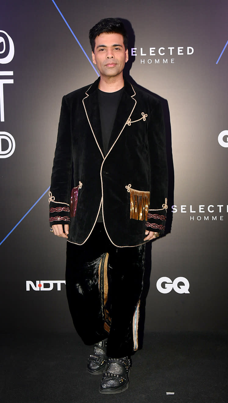 Karan Johar strikes in an all-black Gucci ensemble.