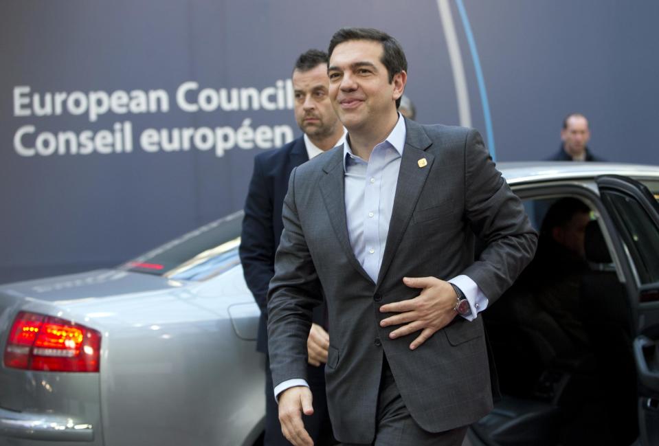 Greek Prime Minister Alexis Tsipras, center, arrives for an EU Summit in Brussels on Thursday, Dec. 15, 2016. European Union leaders meet Thursday in Brussels to discuss defense, migration, the conflict in Syria and Britain's plans to leave the bloc. (AP Photo/Virginia Mayo)