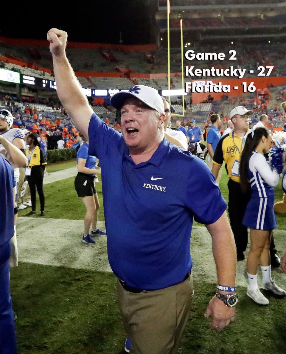 Kentucky head coach Mark Stoops celebrates with fans after defeating Florida 27-16 during the second half of an NCAA college football game, Saturday, Sept. 8, 2018, in Gainesville, Fla.  