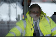 Britain's Prime Minister Boris Johnson steers a tug boat during a General Election campaign trail stop in the port of Bristol, England, Thursday, Nov. 14, 2019. Britain goes to the polls on Dec. 12. (AP Photo/Frank Augstein, Pool)