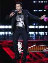 <p>Luis Fonsi takes the stage during Telemundo’s <i>La Voz</i> season 2 finale on Sunday in Miami. </p>