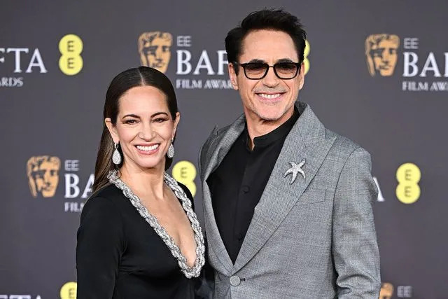 <p>Stephane Cardinale/Getty</p> Robert Downey Jr. and Susan Downey