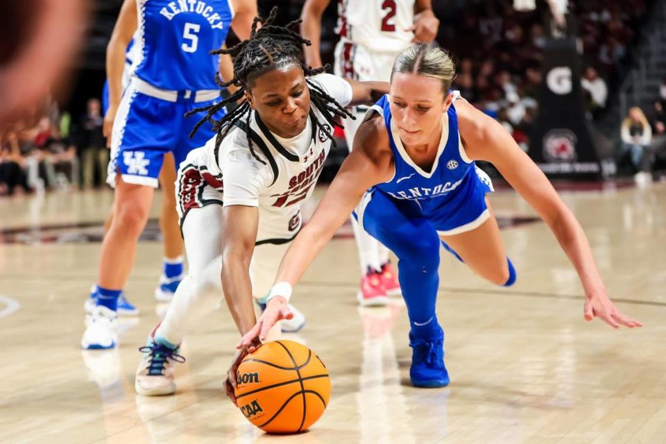 South Carolina guard MiLaysia Fulwiley, left, and Kentucky guard Maddie Scherr (22) dive for a loose ball during their teams’ game at Colonial Life Arena on Jan. 15.
