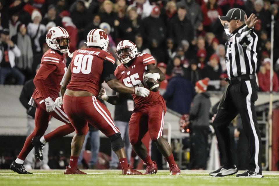 Wisconsin's Maema Njongmeta (55) reacts after recovering a fumble during the first half of an NCAA college football game against Ohio State Saturday, Oct. 28, 2023, in Madison, Wis. (AP Photo/Morry Gash)