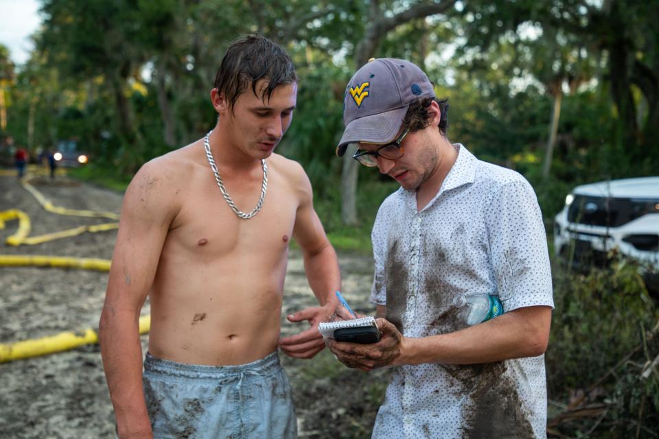 USA Today - Florida Network reporter Douglas Soule, right, interviews Gage Walker after assisting neighbors who were trying to put out a house fire in Suwannee, Fla. on Thursday, Aug. 31, 2023.