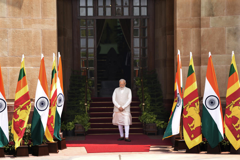 Indian Prime Minister Narendra Modi waits for the arrival of Sri Lankan President Ranil Wickremesinghe in New Delhi, India, Friday, July 21, 2023. (AP Photo/Manish Swarup)