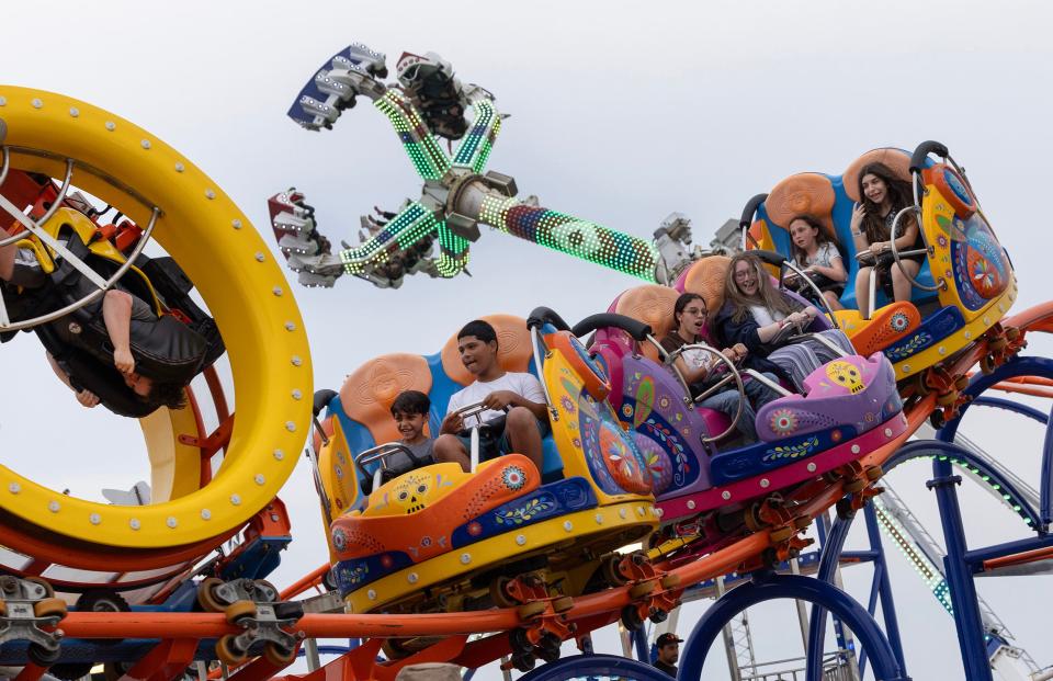 Seaside Rides
Riders react to a sharp run as they ride the Cola Loco ride on Casino Pier. In the background others ride the Super Storm. Families enjoy the rides and games of chance at Casino Pier and the boardwalk in Seaside Heights on July 7, 2023.