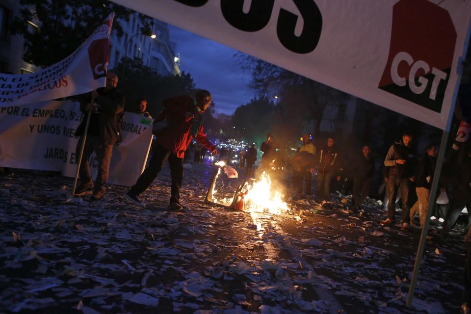 Cleaning workers burn garbage during a protest in Madrid