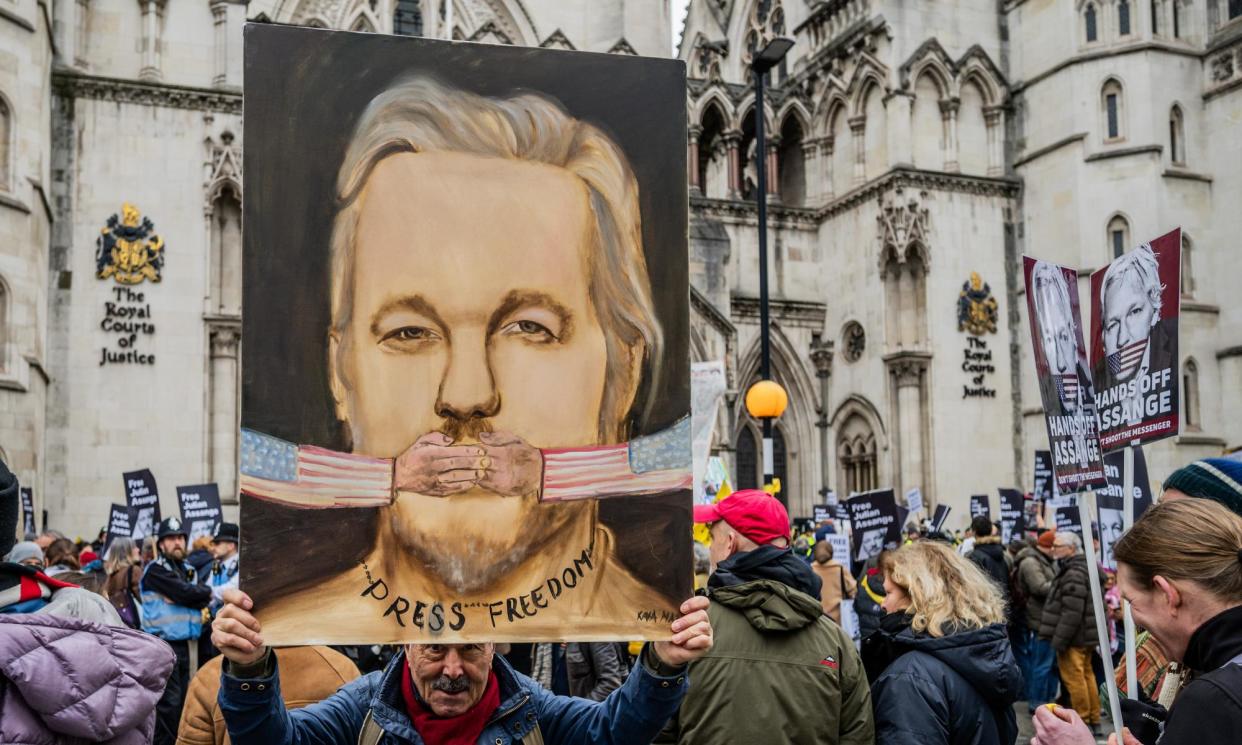 <span>Demonstrators protest in support of Julian Assange outside the Royal Courts of Justice in London on Monday.</span><span>Photograph: Guy Bell/Rex/Shutterstock</span>