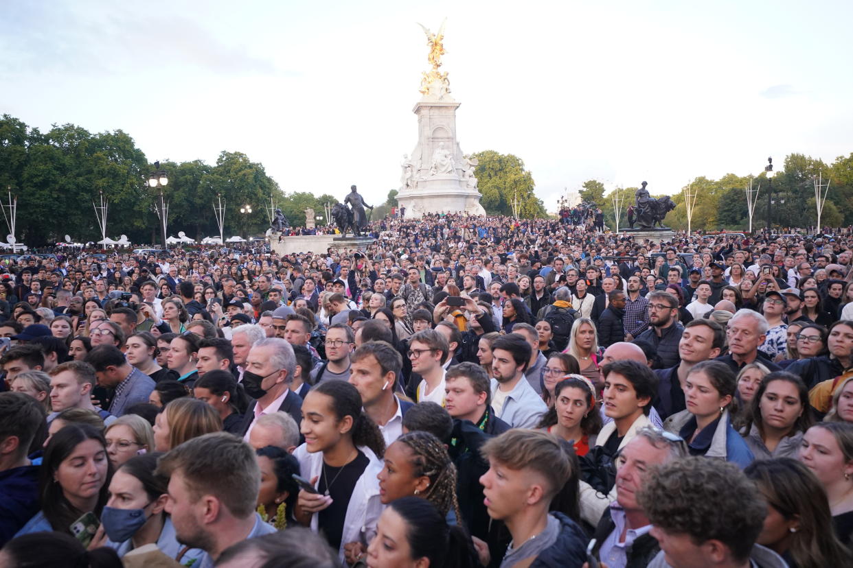 People gather outside Buckingham Palace following the announcement of the death of Queen Elizabeth II. (PA)