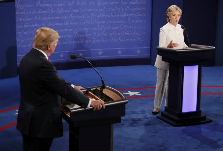 Donald Trump listens as Hillary Clinton speaks during their third and final debate. (Photo: Mark Ralston/Reuters)