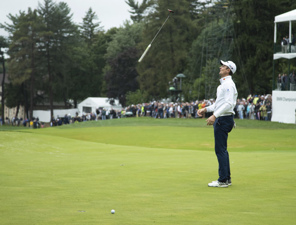 Justin Rose, of England, tosses his club after missing a putt for par on the 18th hole during the BMW Championship golf tournament at the Aronimink Golf Club, Monday, Sept. 10, 2018, in Newtown Square, Pa. Keegan Bradley held off Justin Rose in a sudden-death playoff to win the rain-plagued BMW Championship for his first PGA Tour victory in six years. (AP Photo/Chris Szagola)