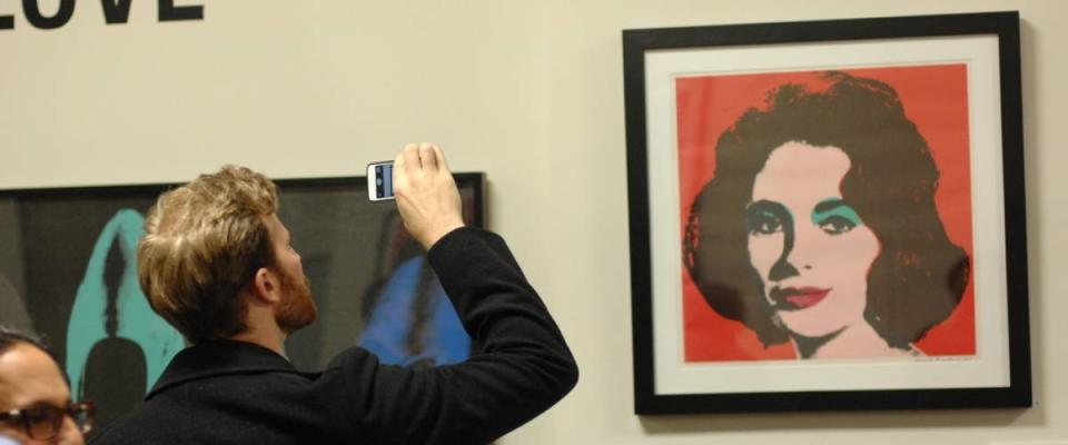 Visitors attend the biggest in Canada exhibition of works of pop art legend Andy Warhol in Yaletown warehouse in Vancouver, Canada.