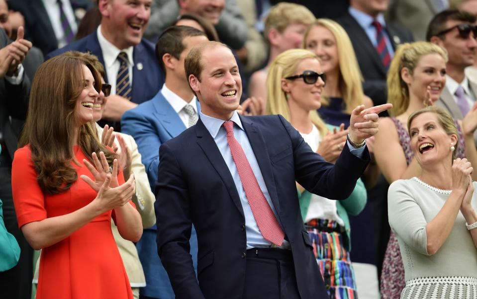 <p>At the 2015 tennis championships, the Duke and Duchess of Cambridge were spotted sharing a joke in the Wimbledon crowd. <em>[Photo: Getty]</em> </p>