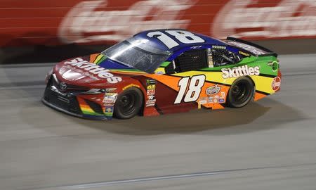 FILE PHOTO: Sep 2, 2018; Darlington, SC, USA; Monster Energy NASCAR Cup Series driver Kyle Busch (18) during the Bojangles' Southern 500 at Darlington Raceway. Mandatory Credit: Adam Hagy-USA TODAY Sports/File Photo