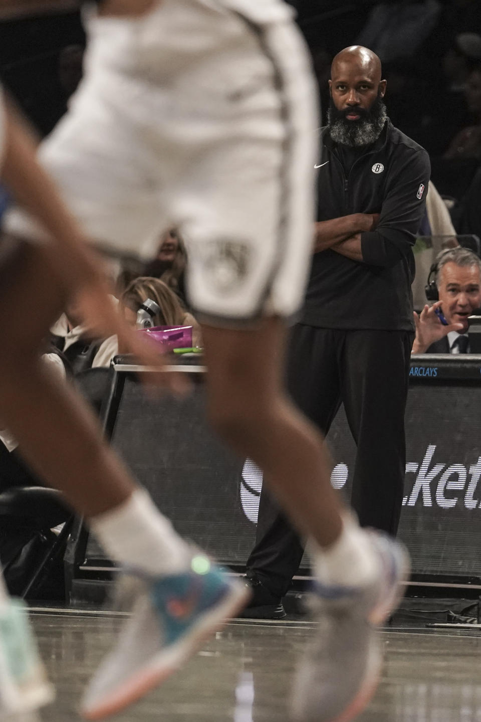 Brooklyn Nets' head coach Jacque Vaughn, right, watches the action during a preseason NBA basketball game against Israel's Maccabi Ra'anana, Thursday, Oct. 12, 2023, in New York. (AP Photo/Bebeto Matthews)