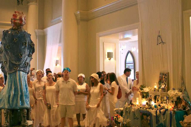<p>Courtesy of International House Hotel</p> Sallie Ann Glassman presides over the St. John&#39;s Eve ritual at International House Hotel. The June 23 holiday is considered the most important feast day within New Orleans Voodoo. Celebrated with a large altar in the hotel lobby and a cleansing ritual that involves head washing. Participants wear all white with a headscarf that can get dirty, they also can bring an offering to Marie Laveau (statue picture). Marie Laveau is considered the Queen Mother of New Orleans Voodoo tradition.