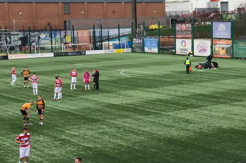 Hamilton's Kyle MacDonald is treated for a head knock in the first half -Credit:Paul Thomson