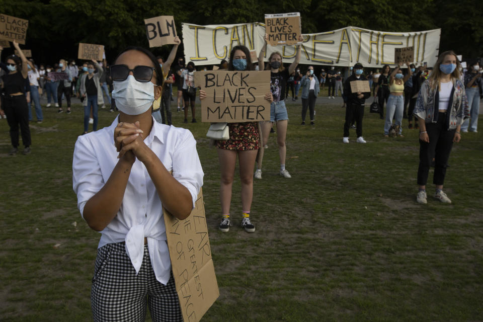 People observe social distancing as they take part in a demonstration in The Hague, Netherlands, Tuesday, June 2, 2020, to protest against the recent killing of George Floyd, police violence and institutionalized racism. Floyd, a black man, died in police custody in Minneapolis, U.S.A., after being restrained by police officers on Memorial Day. (AP Photo/Peter Dejong)