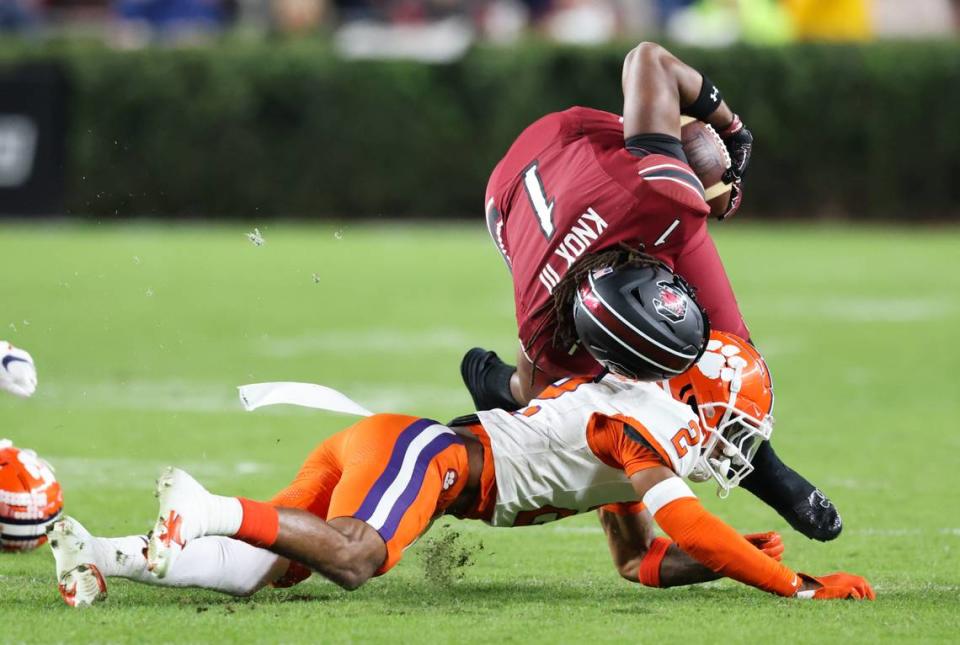 South Carolina tight end Trey Knox (1) is tackled by Clemson cornerback Nate Wiggins (2) during the first half of South Carolina’s game against Clemson at Williams-Brice Stadium in Columbia on Saturday, November 25, 2023.