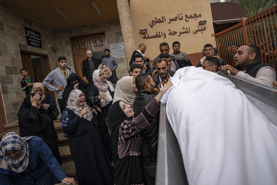 Palestinians mourn their relatives killed in the Israeli bombardment of the Gaza Strip, in the hospital in Khan Younis, Wednesday, Nov. 15, 2023. ( AP Photo/Fatima Shbair)