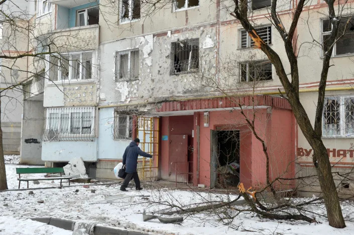 A view of a residential building damaged by recent shelling in Kharkiv on Feb. 26, 2022. - Russia ordered its troops to advance in Ukraine &quot;from all directions&quot; as the Ukrainian capital Kyiv imposed a blanket curfew and officials reported 198 civilian deaths.