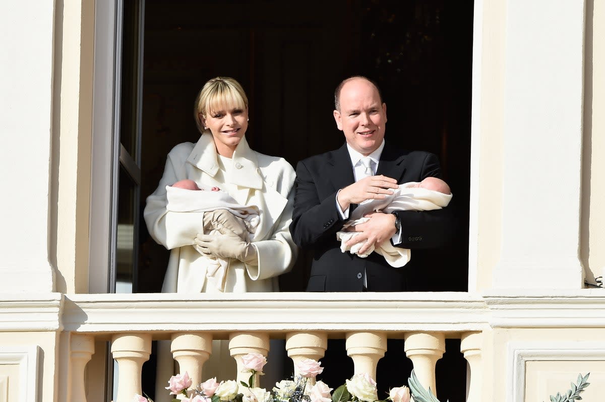 Prince Albert II and Princess Charlene pose with their twins on the Balcony of the Monaco Palace in January 2015 (Getty Images)