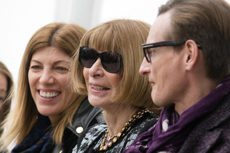 Vogue magazine editor-in-chief Anna Wintour, center, waits for the Derek Lam Fall 2013 fashion show to begin during Fashion Week, Sunday, Feb. 10, 2013, in New York. (AP Photo/John Minchillo)