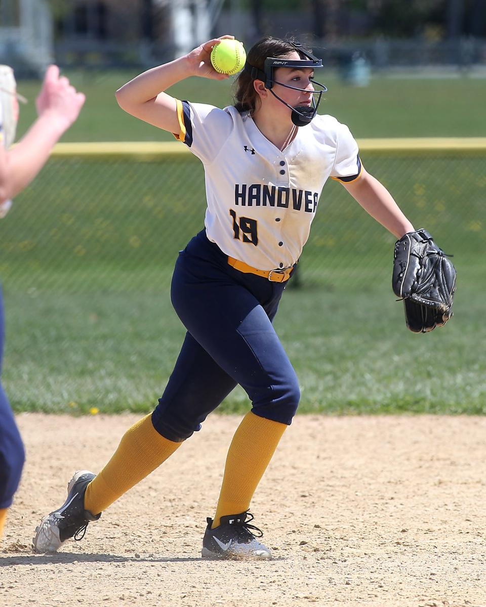 Hanover's Erin Condon prepares to throw to first for the 4-3 putout in the bottom of the second inning of their game at Marshfield High School on Friday, April 22, 2022.