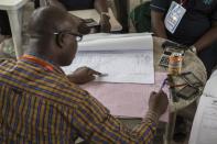 A local representative of the Nigeria Independent National Electoral Commision collates figures from the general election in Port Harcourt, capital of Nigeria's southern oil-rich Rivers State, on March 29, 2015