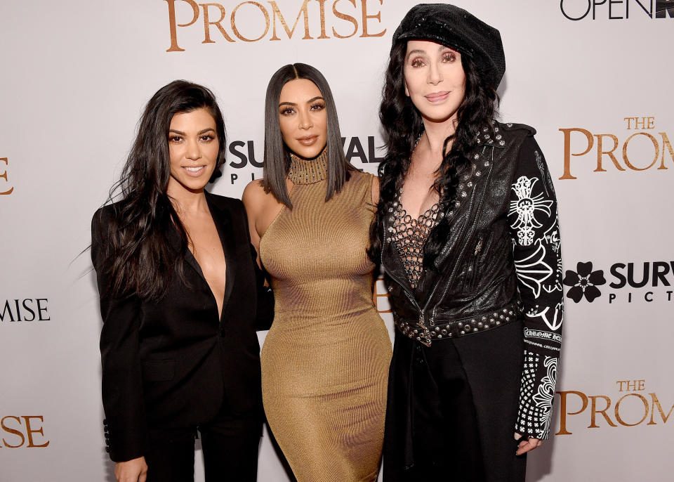 HOLLYWOOD, CA - APRIL 12:  TV personalities Kourtney Kardashian, Kim Kardashian West, and actor/singer Cher attend the premiere of Open Road Films' 'The Promise' at TCL Chinese Theatre on April 12, 2017 in Hollywood, California.  (Photo by Kevork Djansezian/Getty Images)
