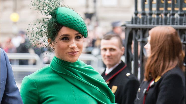 meghan markle in a green dress with matching hat and purse