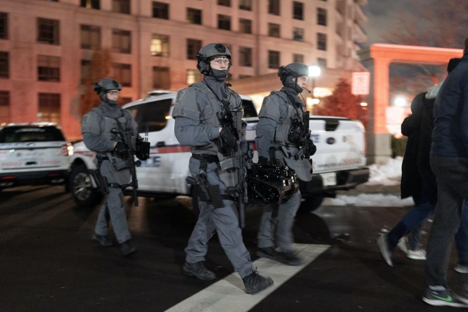 York Regional Police tactical officers attend the scene of a shooting at a condo building in Vaughan, Ont. on Dec. 18, 2022. THE CANADIAN PRESS/Arlyn McAdorey