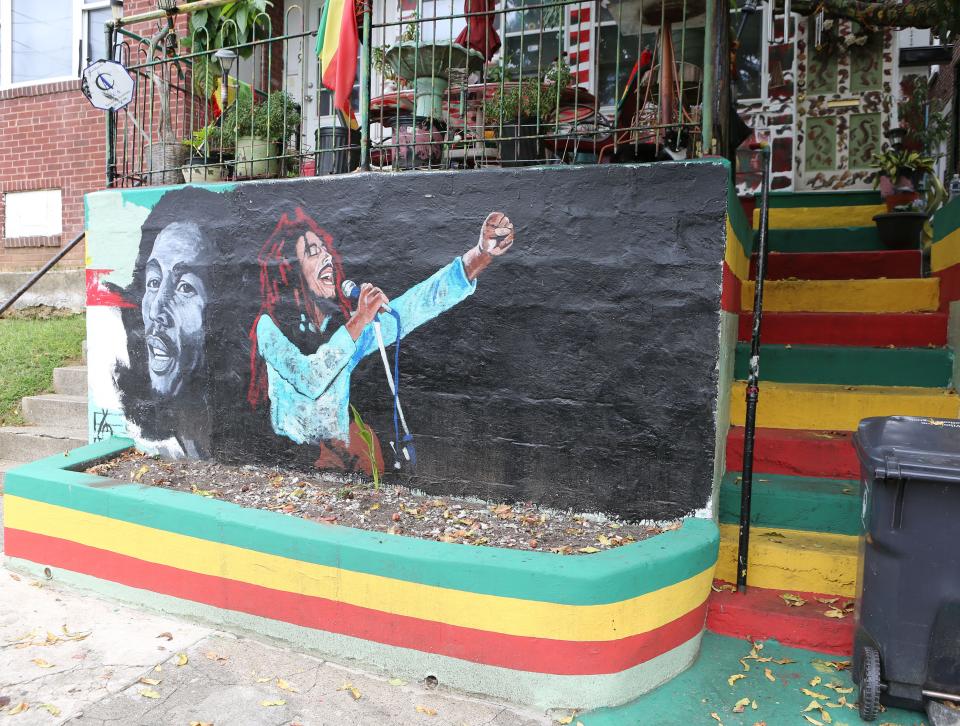A mural on the front of a home at the corner of 24th and Tatnall streets in Wilmington pays tribute to Bob Marley.