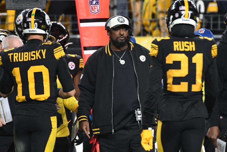 Dec 7, 2023; Pittsburgh, Pennsylvania, USA; Pittsburgh Steelers head coach Mike Tomlin looks out on the field as quarterback Mitch Trubisky (10) and cornerback Darius Rush (21) leave the field against the New England Patriots at Acrisure Stadium. The Patriots won 21-18. . Mandatory Credit: Philip G. Pavely-USA TODAY Sports