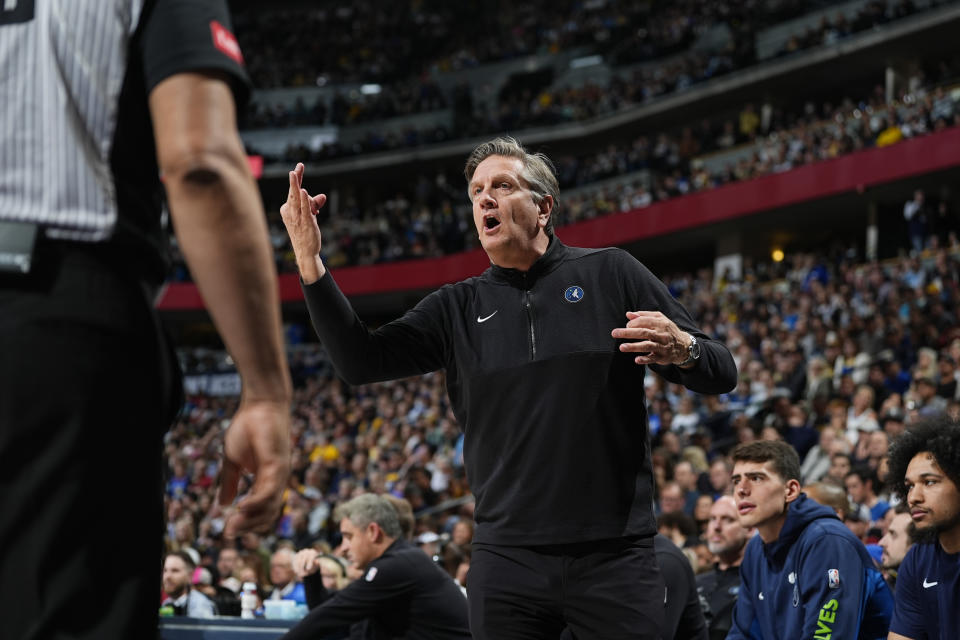 Minnesota Timberwolves coach Chris Finch argues for a call during the first half of the team's NBA basketball game against the Denver Nuggets on Wednesday, April 10, 2024, in Denver. (AP Photo/David Zalubowski)
