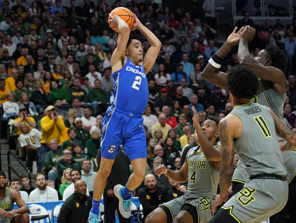 Creighton guard Ryan Nembhard, left, looks to pass the ball as Baylor forward Jalen Bridges, front right, forward Jonathan Tchamwa Tchatchoua and guard LJ Cryer defend in the first half of a second-round college basketball game in the men's NCAA Tournament Sunday, March 19, 2023, in Denver. (AP Photo/John Leyba)