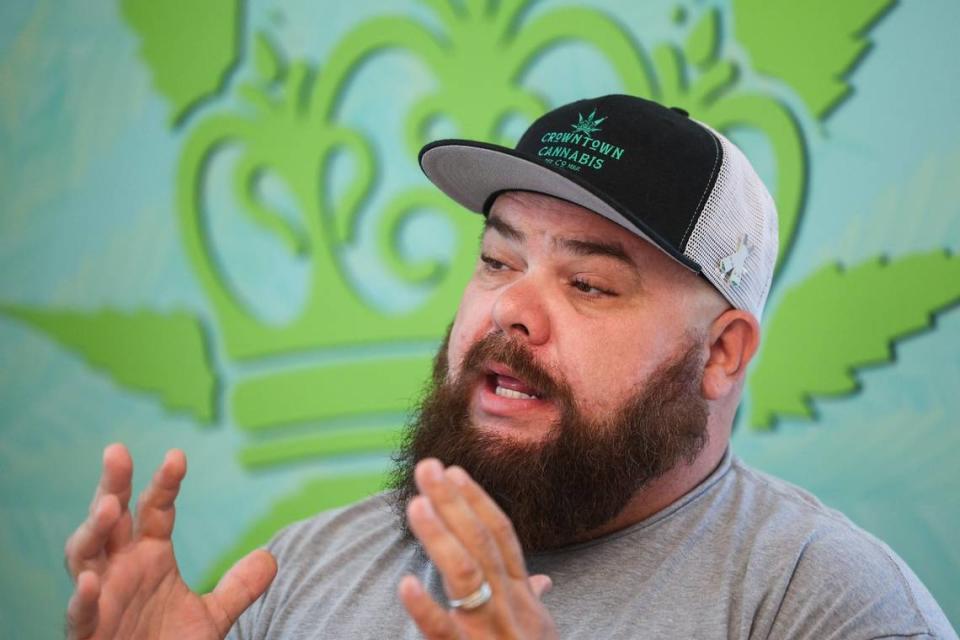 Michael Sims, owner of Crowntown Cannabis, discusses the health benefits of cannabis use inside his shop located on North Davidson Street in NoDa on Tuesday, April 9, 2024.