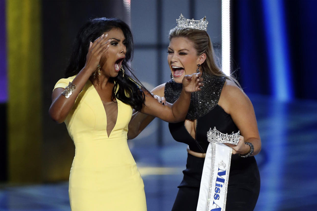 Miss America contestant, Miss New York Nina Davuluri (L) reacts with 2013 Miss America Mallory Hagan after being chosen winner of the 2014 Miss America Pageant in Atlantic City, New Jersey, September 15, 2013.